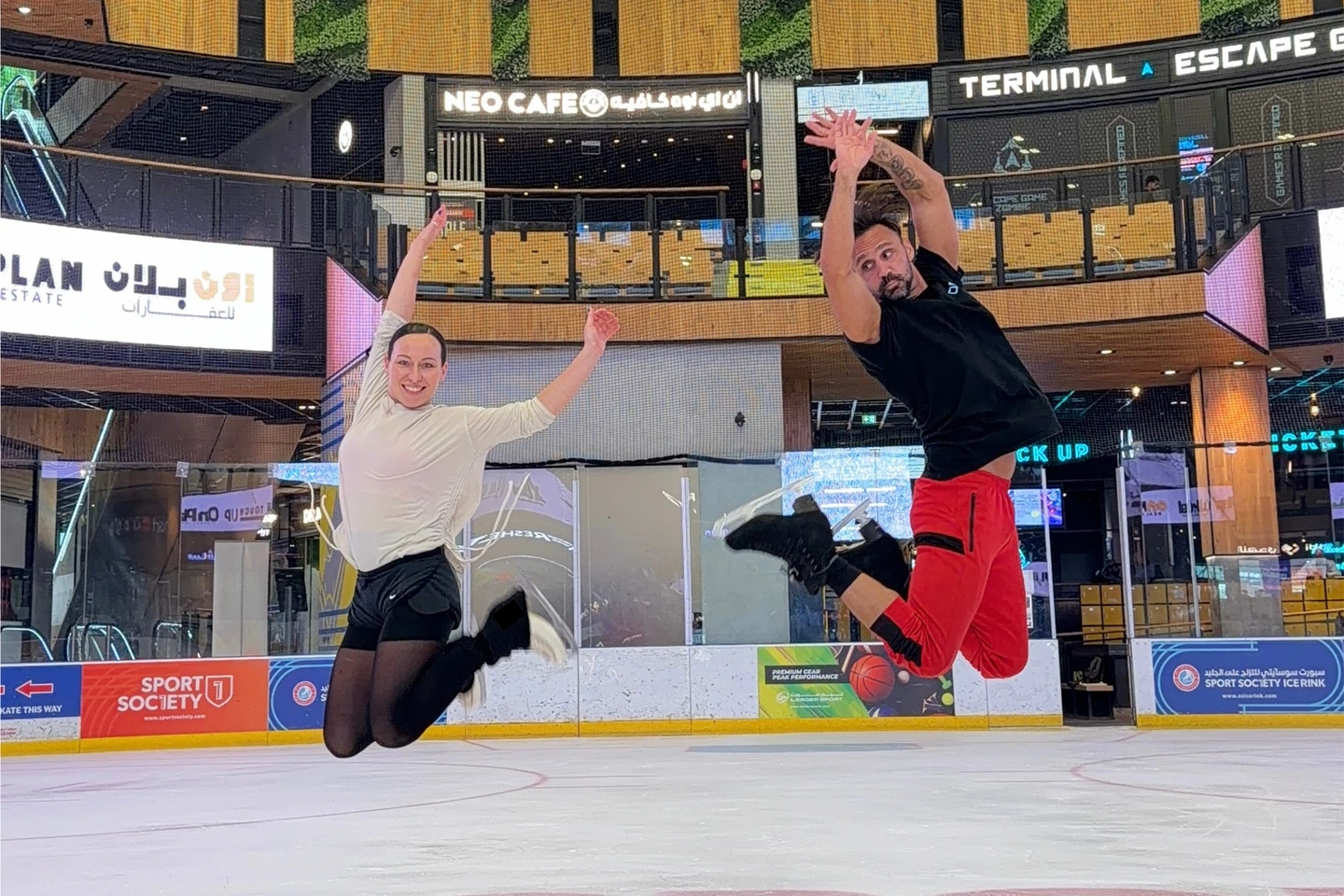 Diamond Skating Club coaches Alexandra Ievleva and Adam Jukes skating together at Sport Society Ice Rink in Dubai.